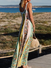 Maxi dress with sweetheart neckline, botanical print, and vertical stripes in cotton.