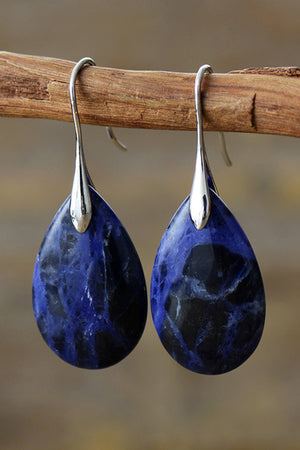 Sapphire stone dangle earrings with silver hooks and gold accents.