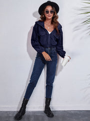 Dark Blue corduroy hooded jacket with zip front and chest pockets.