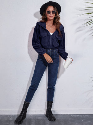Dark Blue corduroy hooded jacket with zip front and chest pockets.