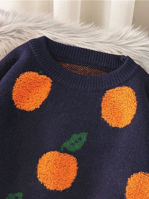 Navy acrylic knit sweater with orange pom-pom fruit pattern and green leaves.