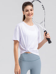 White performance t-shirt with short sleeves and a knotted hem detail.