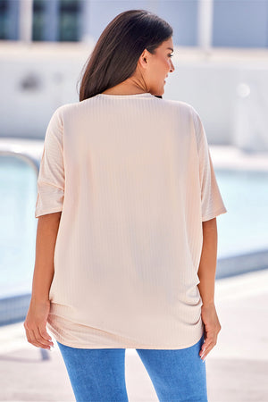 Tan ribbed batwing cardigan with draped front detail.