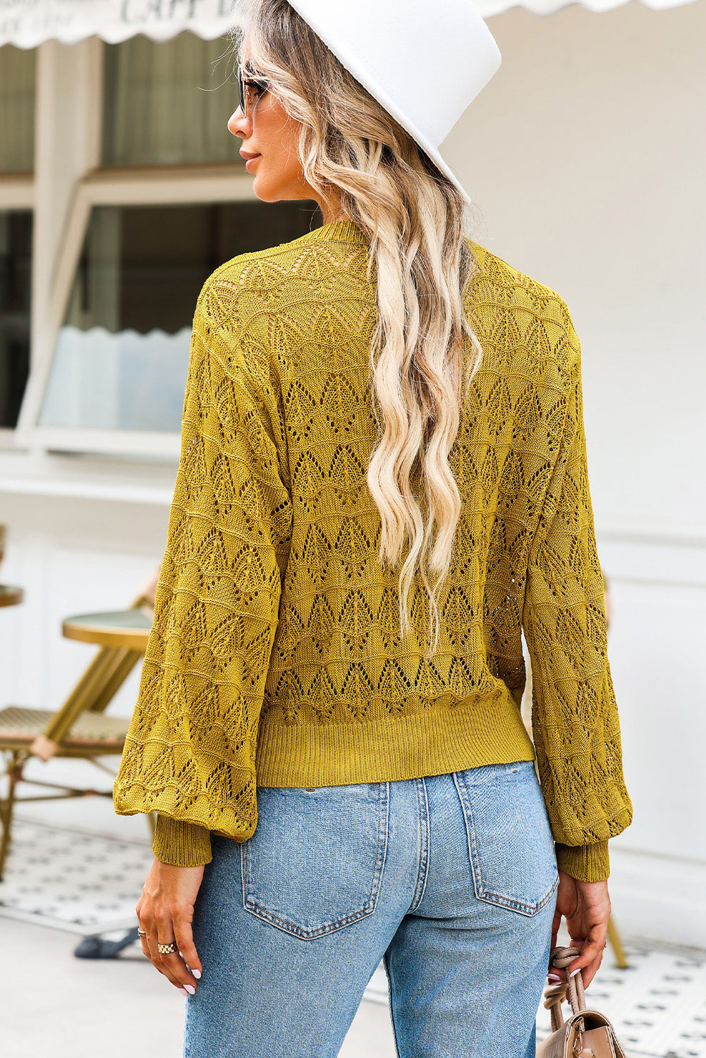Openwork knit cardigan in Chartreuse with balloon sleeves and a buttoned front.
