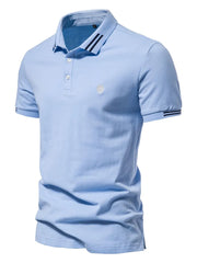 Light blue textured polo shirt with striped collar and sleeve detail.