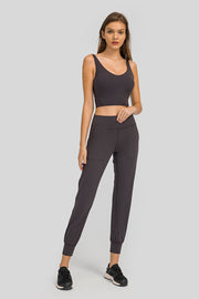 Dark Gray Jogger Fit Pocketed Performance Trousers with cuffed ankles and side pockets.