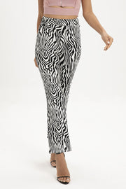Zebra print flared leg trousers with a high waist and ankle length.
