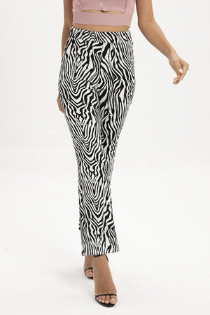 Zebra print flared leg trousers with a high waist and ankle length.