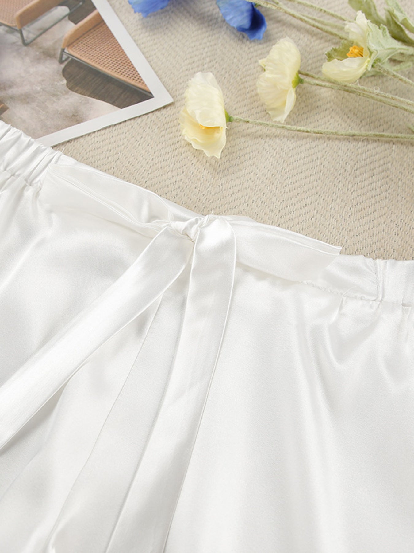 White satin lounge shorts with drawstring and lace trim detail