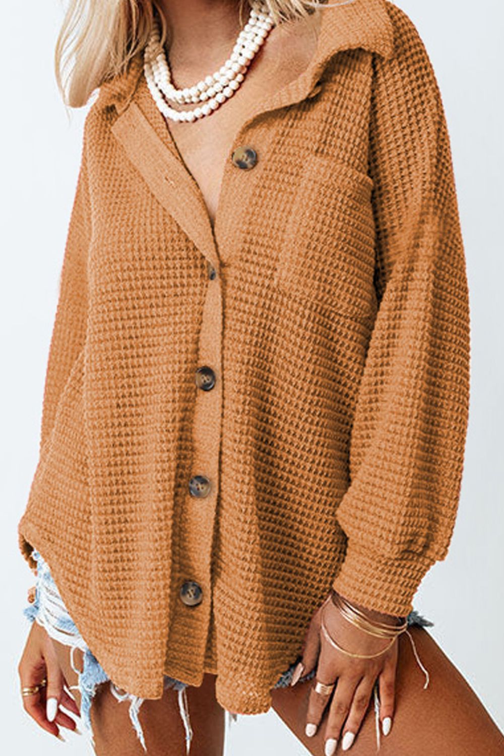 Caramel waffle knit button-down shirt jacket with a collared neckline and button closure.