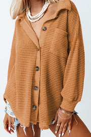 Caramel waffle knit button-down shirt jacket with a collared neckline and button closure.