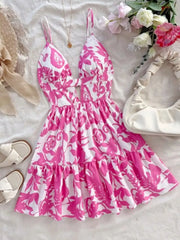 Vibrant floral cutout mini dress with a deep V-neck and tiered skirt.