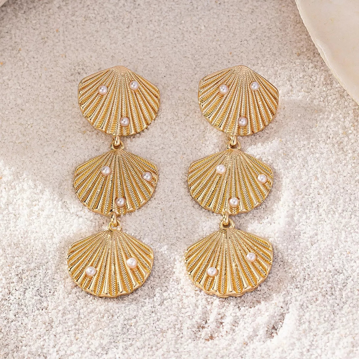 Gold seashell dangle earrings with pearls, 18K gold-plated.