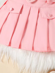 Pink baby skirt with pleats, buttoned pockets, and a bowknot belt detail.