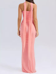 Pink sweetheart tube top maxi dress with ruched detail and flowing scarf detail.