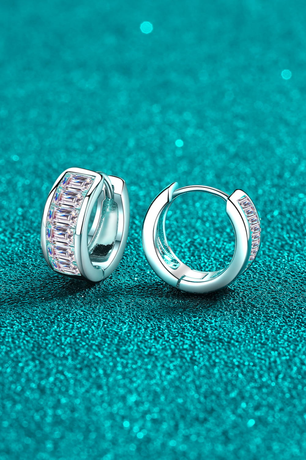 Silver baguette cut crystal huggie hoop earrings with baguette cut crystals.