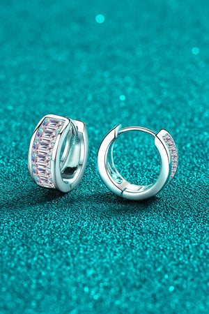 Silver baguette cut crystal huggie hoop earrings with baguette cut crystals.