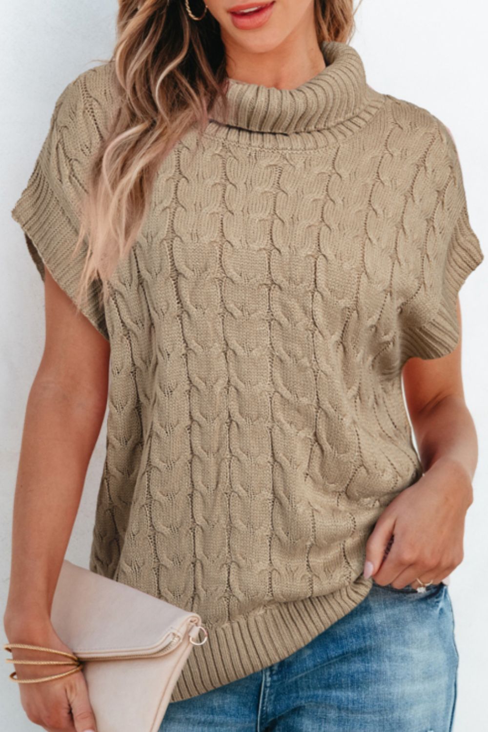 Khaki cable knit turtleneck capelet sweater with short sleeves.