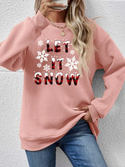 Blush pink crewneck sweatshirt with "Let It Snow" graphic and snowflakes.