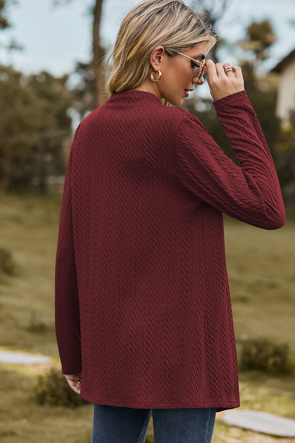 Burgundy textured open-front drape cardigan with long sleeves and a mock neck.