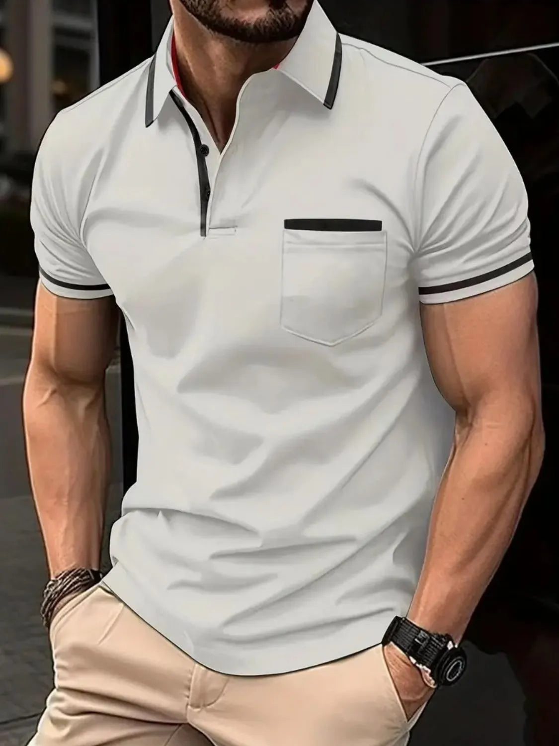 White short sleeve polo with black contrast trim on collar, pocket, and sleeves.