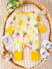Yellow baby one-piece with bee and honeycomb print, long sleeves, yellow cuffs.