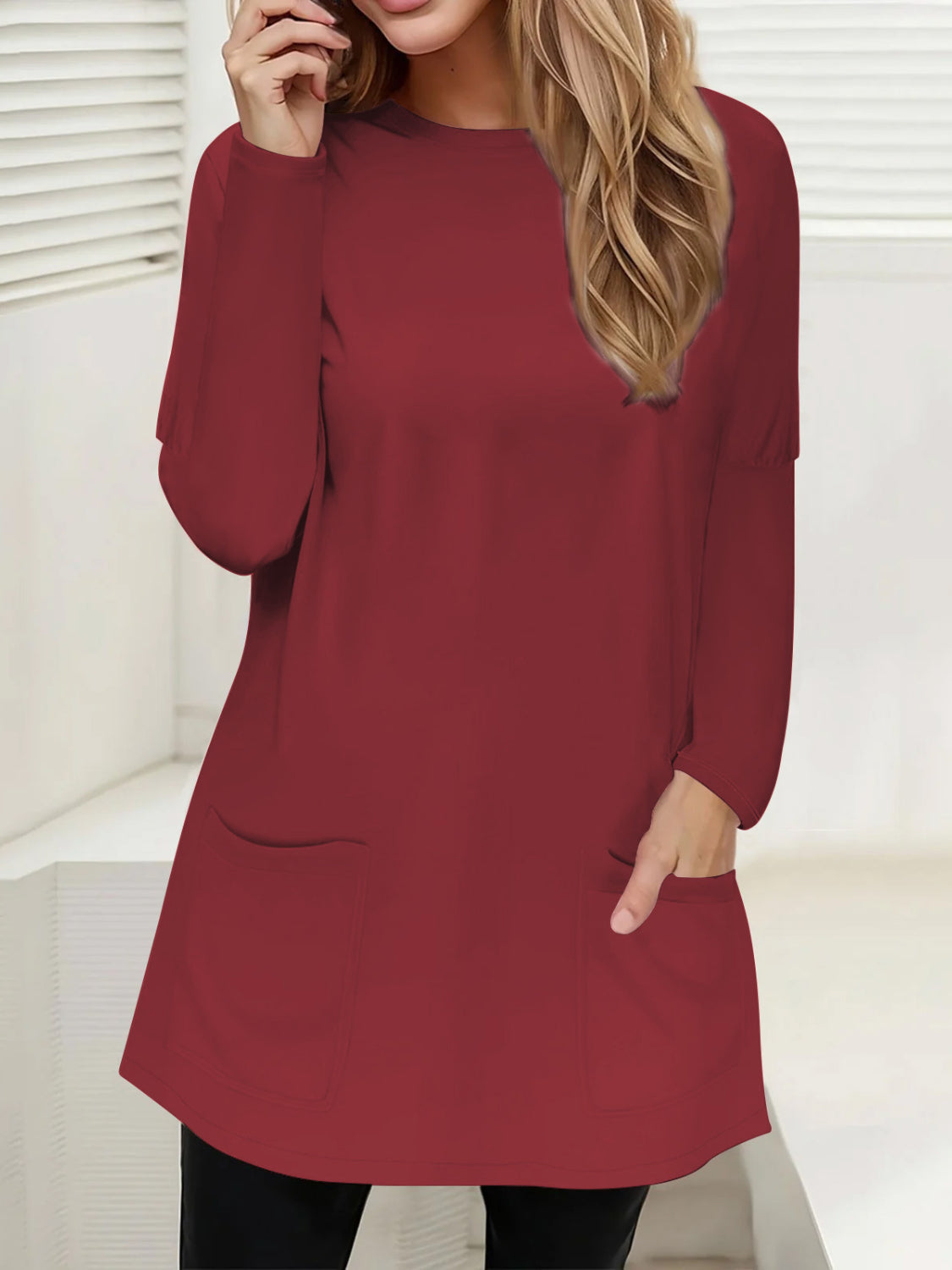 Relaxed fit burgundy tunic with long sleeves and two patch pockets.