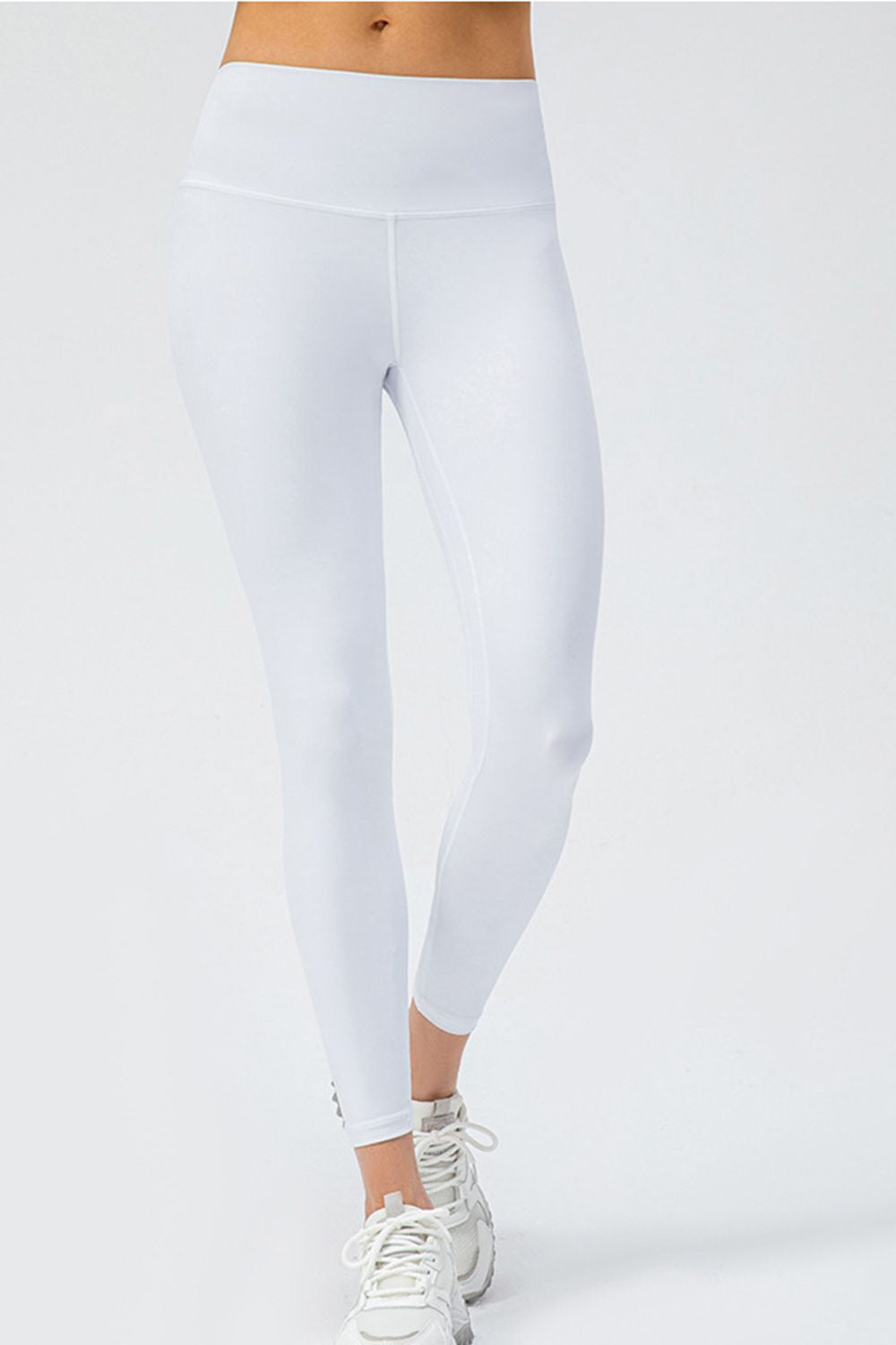White high-rise performance leggings with a sculpted fit and seamless waistband.