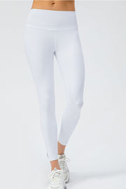 White high-rise performance leggings with a sculpted fit and seamless waistband.