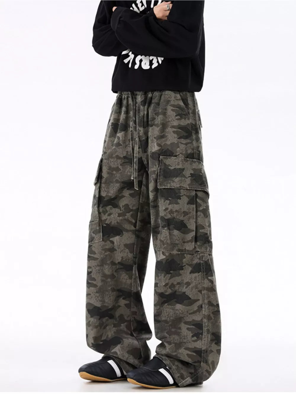 Urban camouflage cargo sweatpants with drawstring waist and multiple pockets.