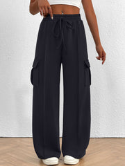 Navy high waist cargo sweatpants with drawstring and side pockets.