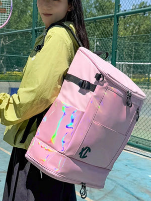 Spacious pink travel bag with iridescent panel and buckle closure.