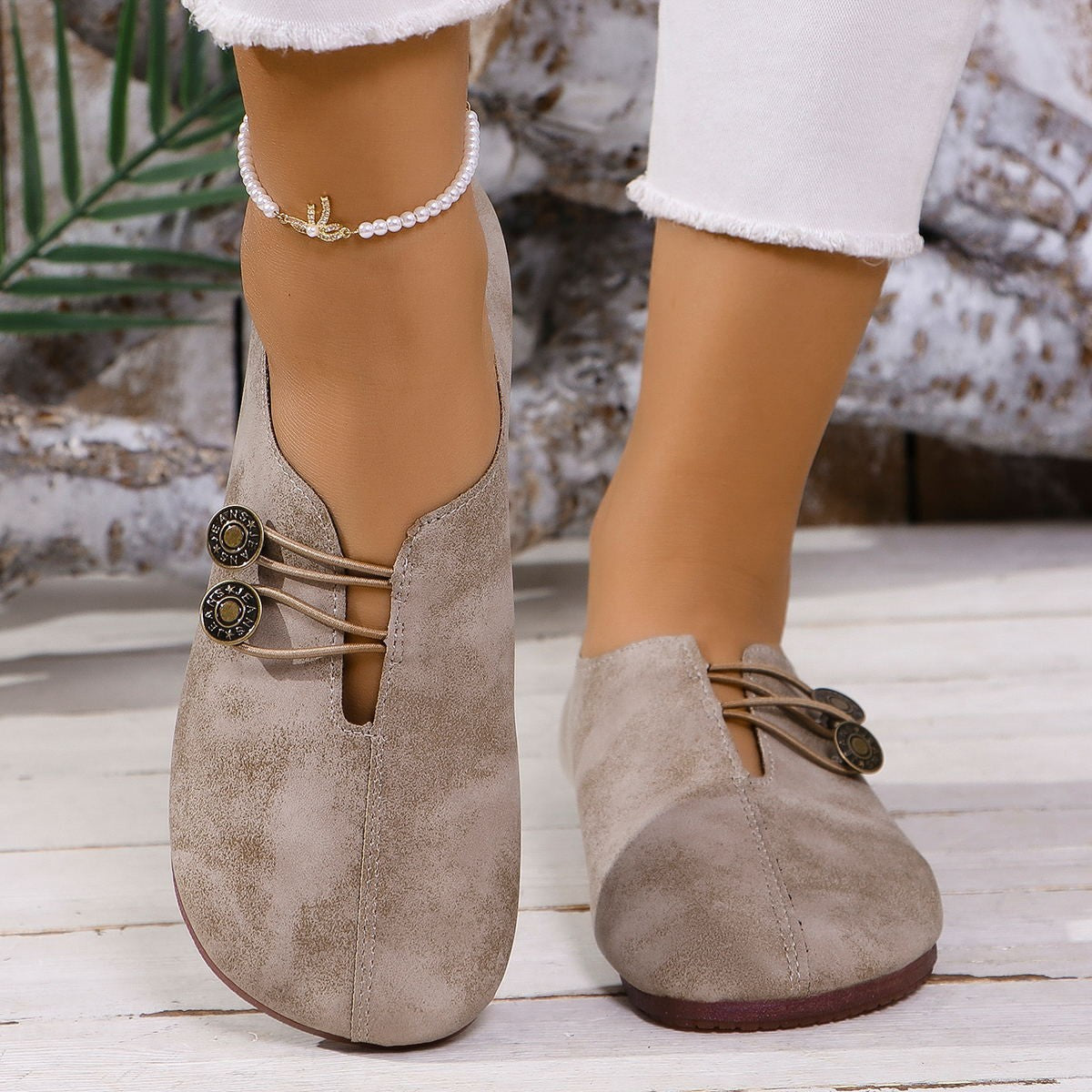 Chic round-toe casual flats in light brown with decorative buttons and elastic laces.