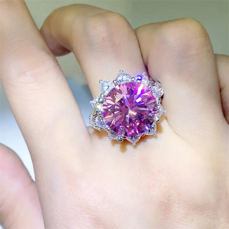 Radiant Blossom cocktail ring in silver with a large pink gemstone and halo of smaller stones.