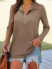 Khaki ribbed knit half-zip sweater with collar and long sleeves.