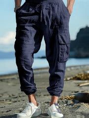 Navy blue cargo pants with drawstring detail and elastic cuffs.