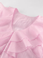 Pink ruffle trim long sleeve blouse with V-neckline and sheer fabric.