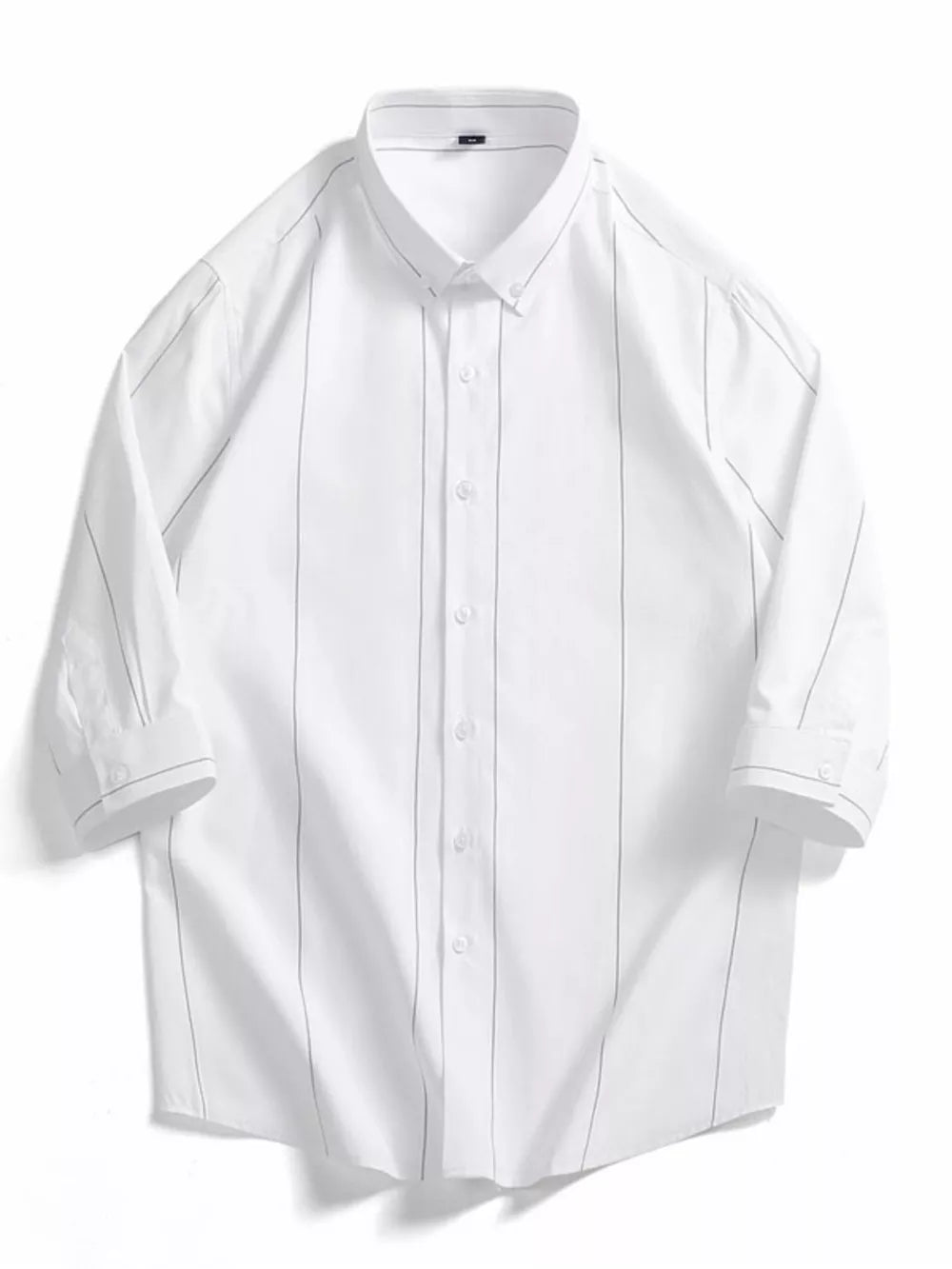 White cotton oversized button-down shirt with subtle grey pinstripes and rolled sleeves.