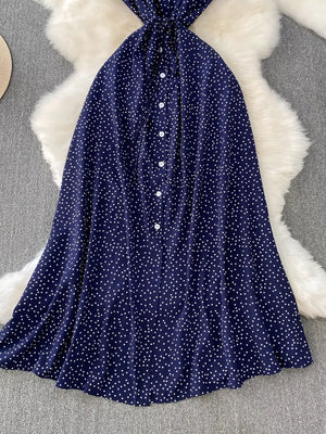 Dark Blue polka dot maxi dress with button front and tie waist detail.