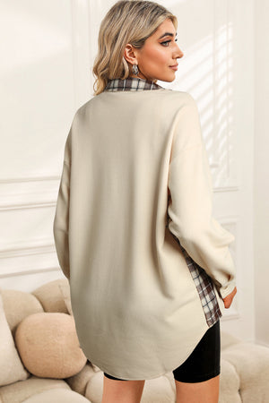 Cream waffle knit overshirt with plaid trim detail and button cuffs.
