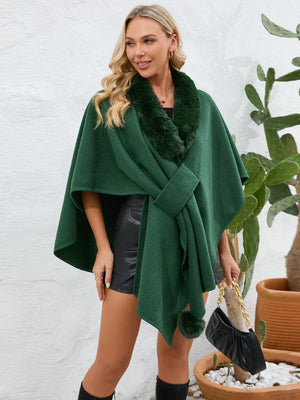 Dark green faux fur collar wrap poncho with tie closure and pom-pom detail.