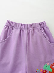 Girls' purple cotton shorts with elastic waist, pockets, and a dinosaur embroidery detail.
