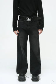 Dark wash wide-leg denim jeans with vertical seams and a relaxed fit.
