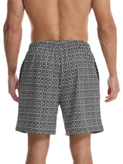 Geometric print boardshorts in black with a white pattern.