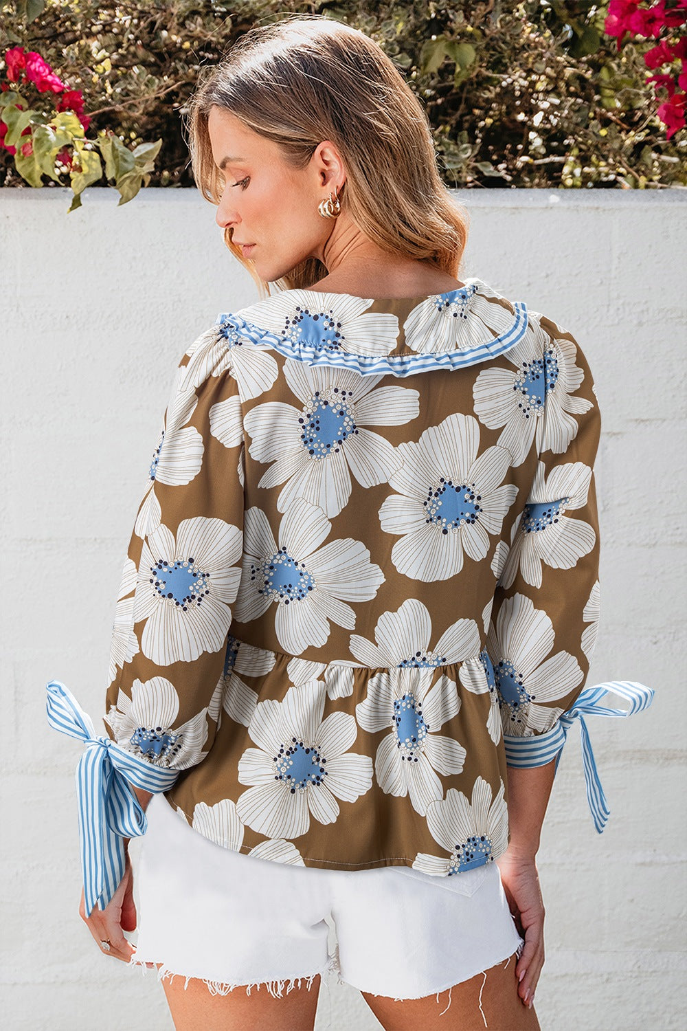 Floral print blouse in camel with Peter Pan collar and tie sleeves.