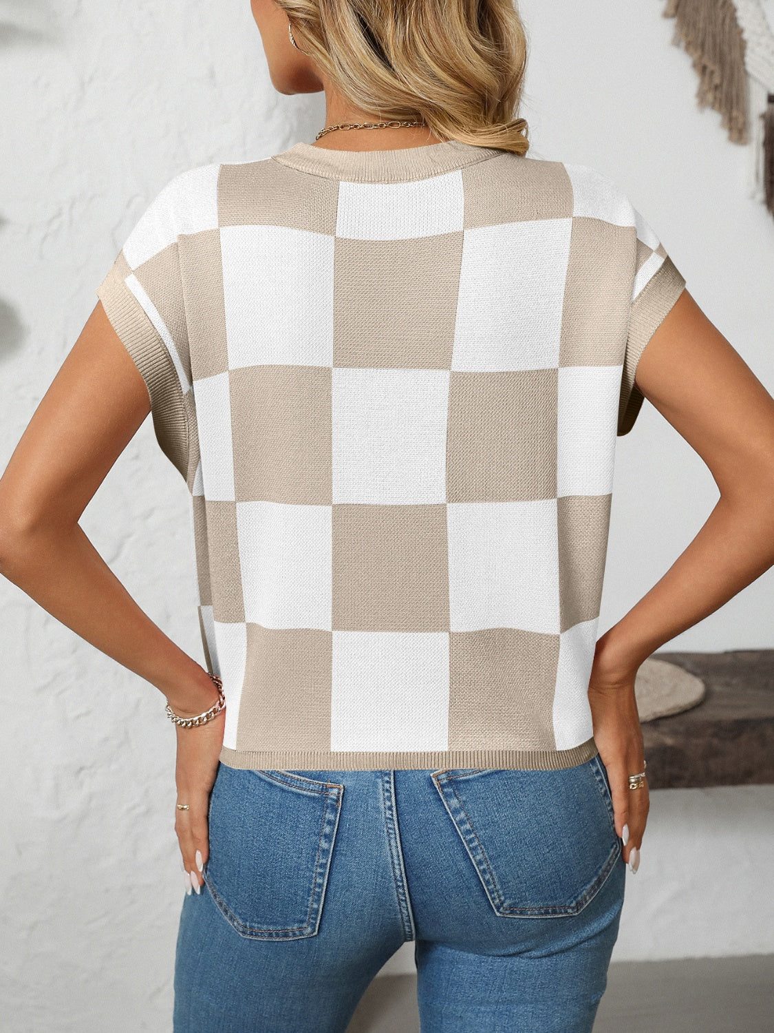 Checkerboard knit cap sleeve top in beige and white with a crew neck.