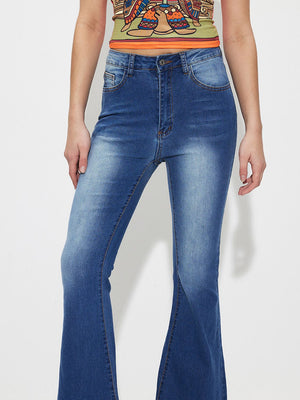 Mid-rise flare jeans in medium wash denim with a buttoned fly.
