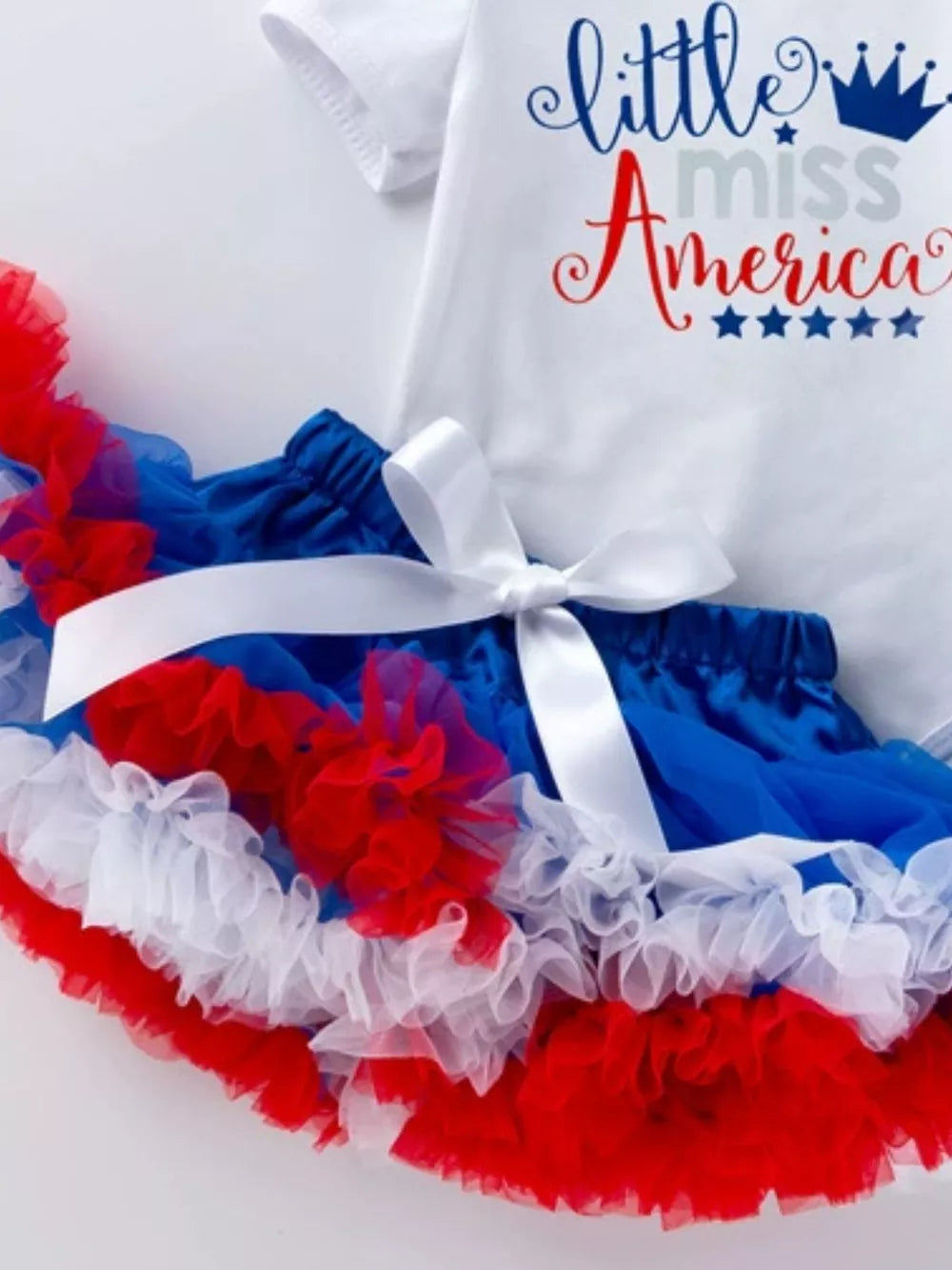 Baby outfit set with white "little miss America" bodysuit and red, white, blue ruffled tutu.