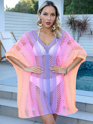 Ombre crochet kaftan cover-up with V-neck and open knit pattern in pink, purple, and orange hues.