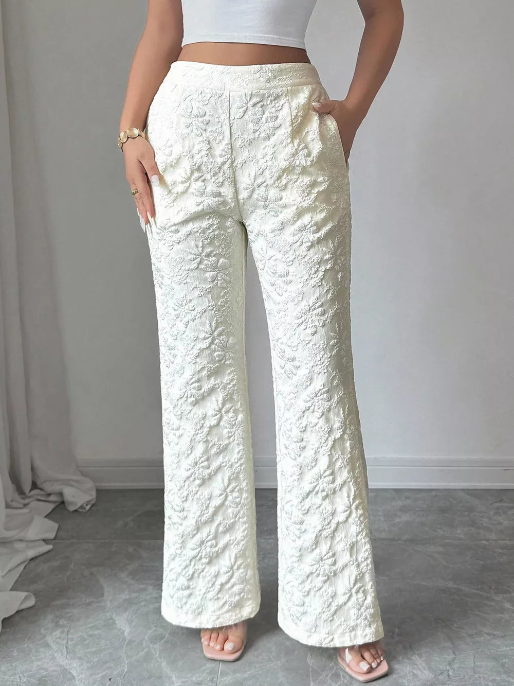White floral textured high-waisted maternity pants with a wide leg